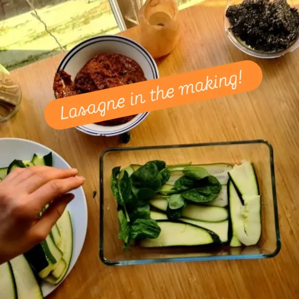 Raw zucchini lasagne being assembled in the kitchen